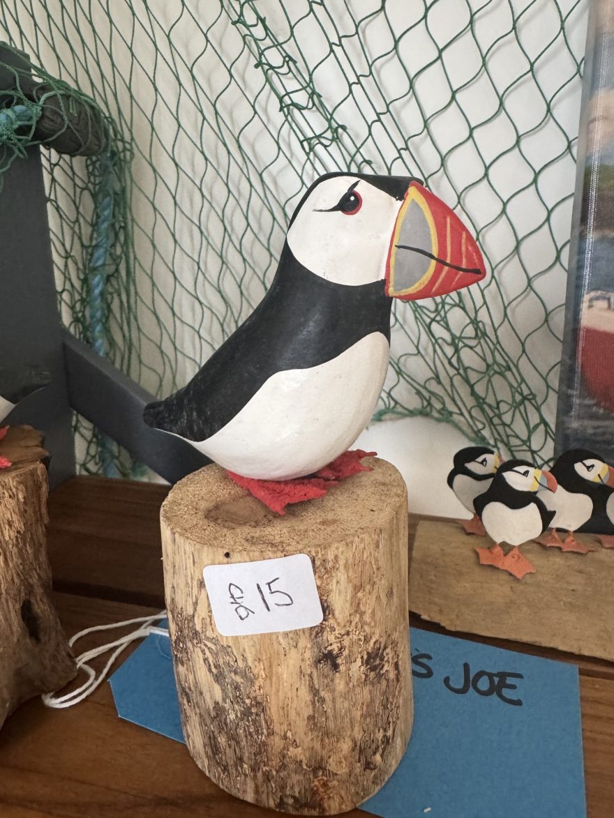 Wooden Puffin on a log